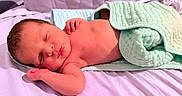 Emmanuel Malachi is registered to the contest to win money with this photo: baby, bed, blanket, child, comfort, cute, indoors, infant, lying_down, newborn, peaceful, portrait, relaxation, rest, skin, sleeping, small, soft, toddler, wrapped
