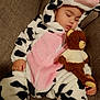 baby, brown_fabric, child, closed_eyes, costume, couch, cow_onesie, cozy, cute, foot, hand, indoors, peaceful, plush_toy, portrait, resting, sleeping, soft_texture, teddy_bear, toddler