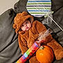 autumn, baby, bear, brown, candy, child, costume, couch, cozy, cute, face, fall, holiday, indoor, orange, person, plush, pumpkin, toy, wrapped