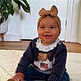 Alora joined the competition — help win amazing prizes! baby, smiling, headband, bow, sweater, dog_pattern, american_flag, jeans, boots, indoor, rug, plant, door, floor, happy, child, infant, candid, portrait, cute