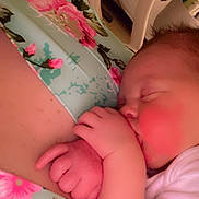 Gracie joined the competition — help win amazing prizes! baby, sleeping, hand, face, infant, skin, clothing, floral_pattern, fabric, closeup, cute, peaceful, resting, child, newborn, soft_light, indoors, person, cozy, portrait