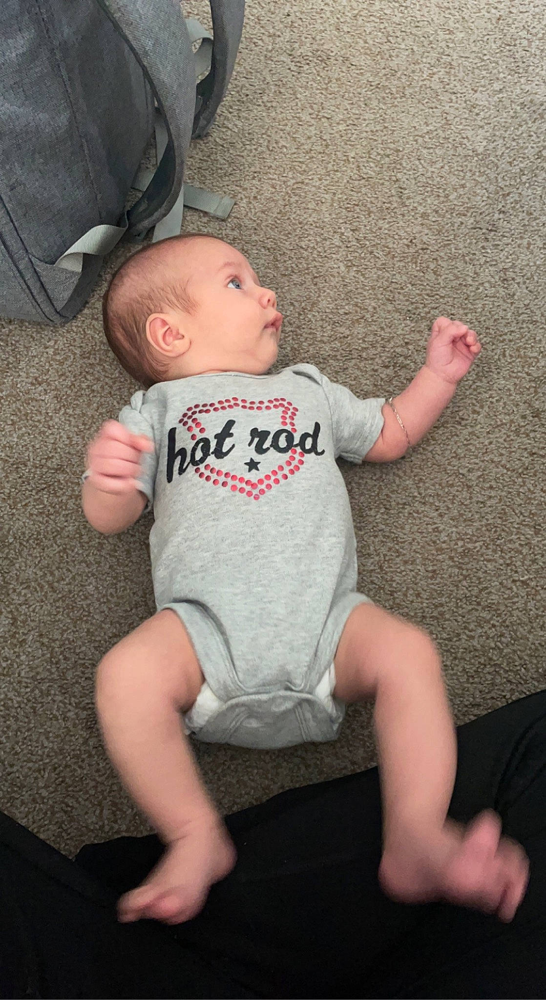 Brian is registered to the contest to win money with this photo: baby, baby_toddler_clothing, cheek, comfort, finger, flash_photography, gesture, grass, head, human_body, joint, knee, lap, leg, person, shoulder, skin, sleeve, sock, t_shirt
