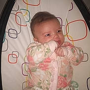 Sofia joined the competition — help win amazing prizes! baby, infant, onesie, floral, baby_seat, patterned, hand_in_mouth, cute, comfort, indoor, child, face, expression, sitting, soft_lighting, young, small_hands, pacifier, colorful, fabric