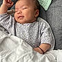 Xuân Lan participe au concours pour gagner de l'argent avec cette photo : baby, sleeping, blanket, clothing, cushion, face, infant, person, resting, soft, smile, toddler, young_child, comfort, indoor, cute, peaceful, nursery, fabric, relaxation