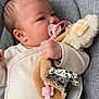 Xuân Lan participe au concours pour gagner de l'argent avec cette photo : baby, infant, pacifier, plush_toy, cushion, seat, clothing, hand, face, skin, hair, comfort, child, cute, indoors, fabric, soft, head, young, resting