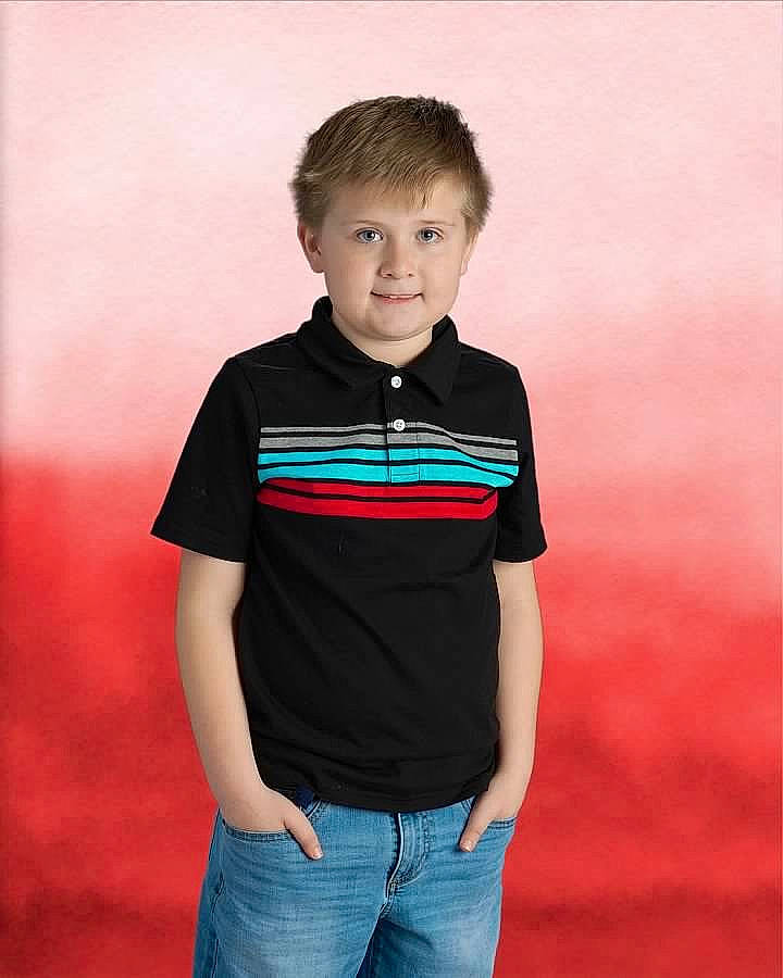 Jayce is registered to the contest to win money with this photo: child, child_model, clothing, collar, neck, person, polo_shirt, shoulder, sleeve, standing, t_shirt, toddler, top