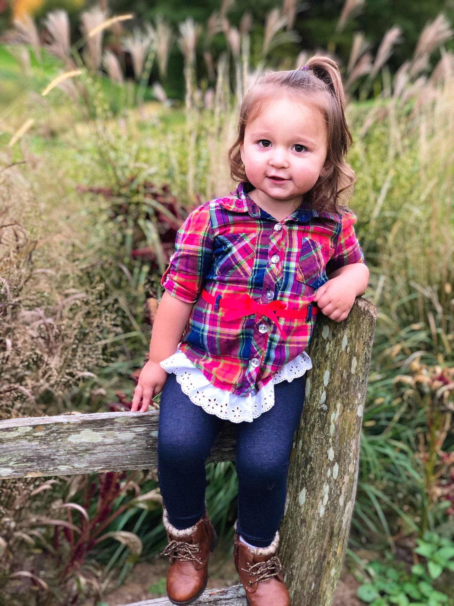 Natalyn is registered to the contest to win money with this photo: child, child_model, design, grass, green, leaf, leggings, outerwear, pattern, people, person, photograph, photography, plaid, plant, portrait_photography, tartan, textile, toddler, tree