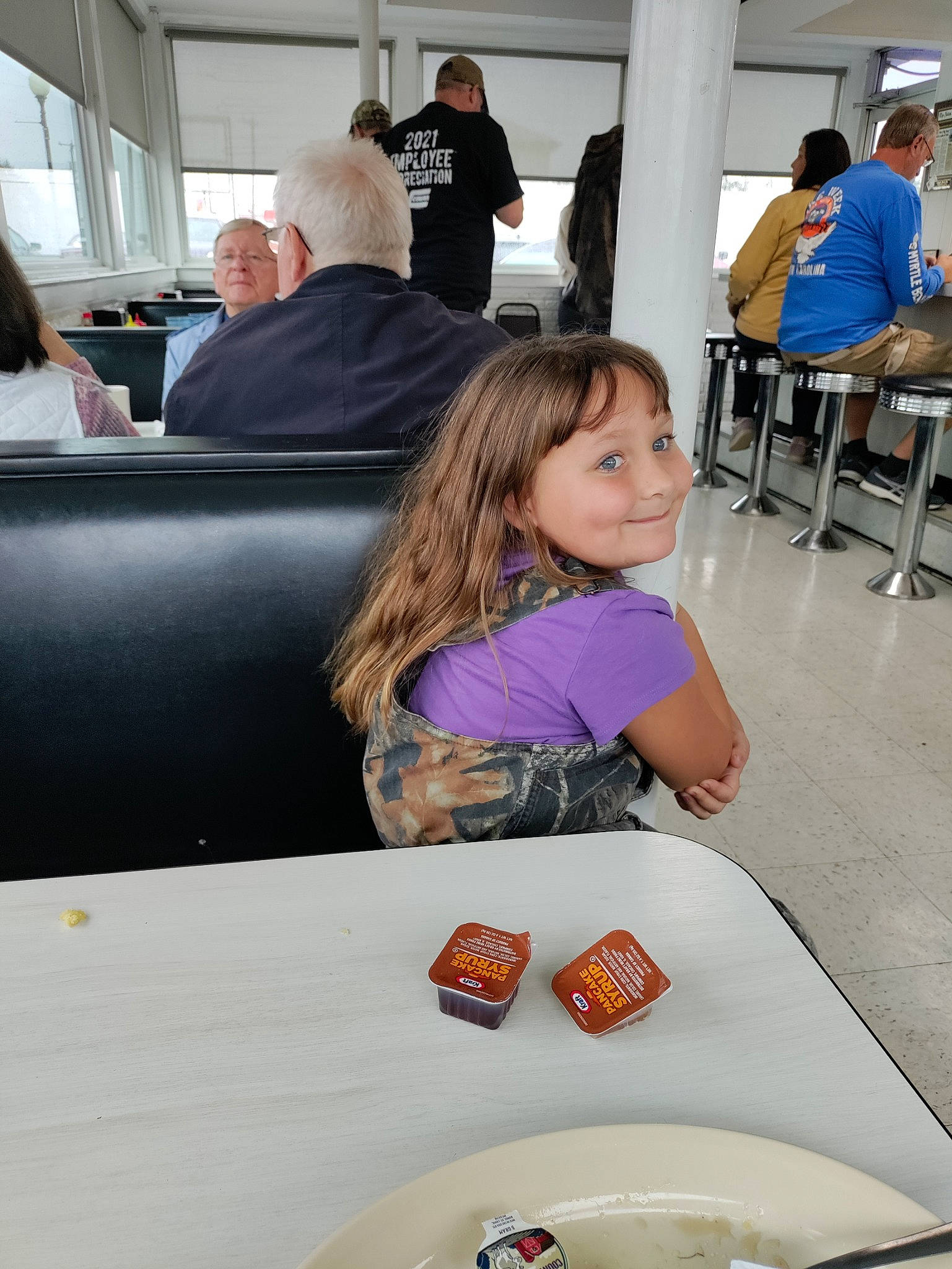 Bethany joined the competition — help win amazing prizes! automotive_design, chair, child, comfort_food, cuisine, dish, event, flooring, food, fun, joy, leisure, luxury_vehicle, person, plate, recreation, smile, t_shirt, table, tableware