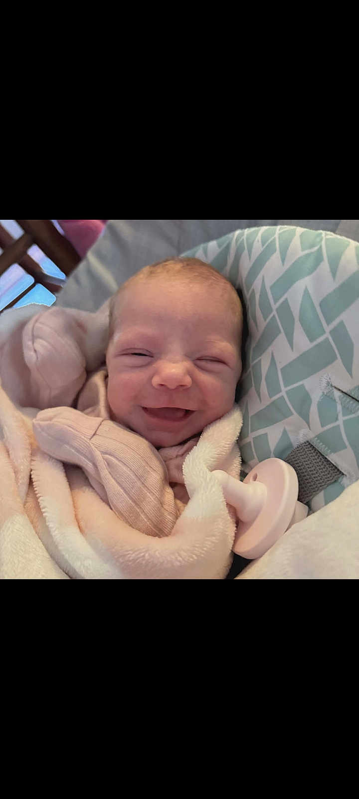 Aubree joined the competition — help win amazing prizes! baby, newborn, smile, blanket, pacifier, cushion, infant, face, sleepwear, comfort, cute, soft, resting, indoors, child, person, cozy, head, happy, wrapped