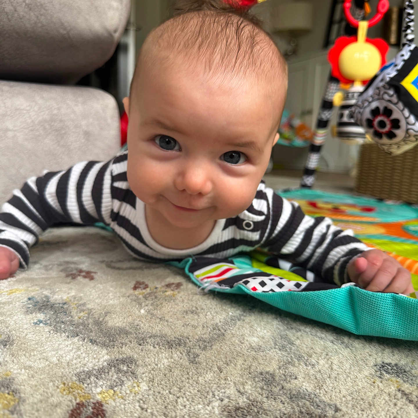 Francessca is registered to the contest to win money with this photo: baby, bodypart, clothing, couch, crawling, cushion, face, finger, furniture, hand, happy, head, homedecor, person, photography, portrait, quilt, sitting, smile, toy