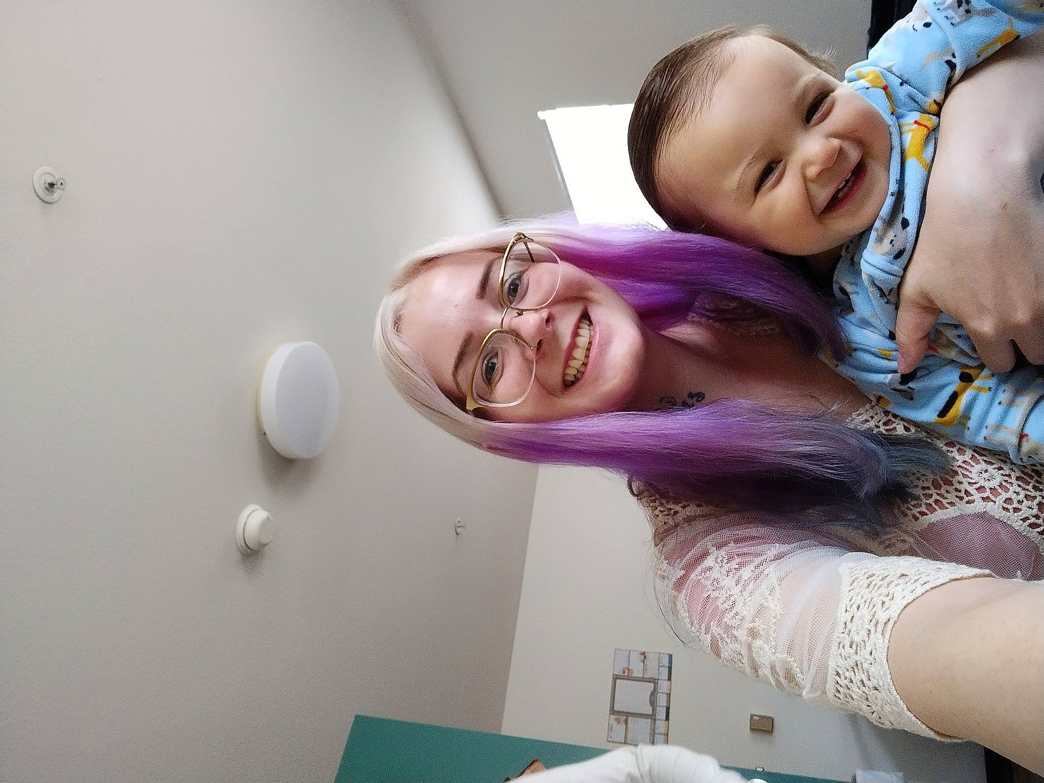 Christopher is registered to the contest to win money with this photo: abdomen, baby, black_hair, child, event, eyewear, face, finger, fun, glasses, happy, jewellery, joy, leisure, magenta, person, pink, room, skin, smile