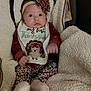 Riley joined the competition — help win amazing prizes! baby, infant, child, face, headband, bib, clothing, blanket, patterned_pants, socks, cute, thanksgiving, flower, leopard_print, cozy, indoors, soft_texture, portrait, seated, expression