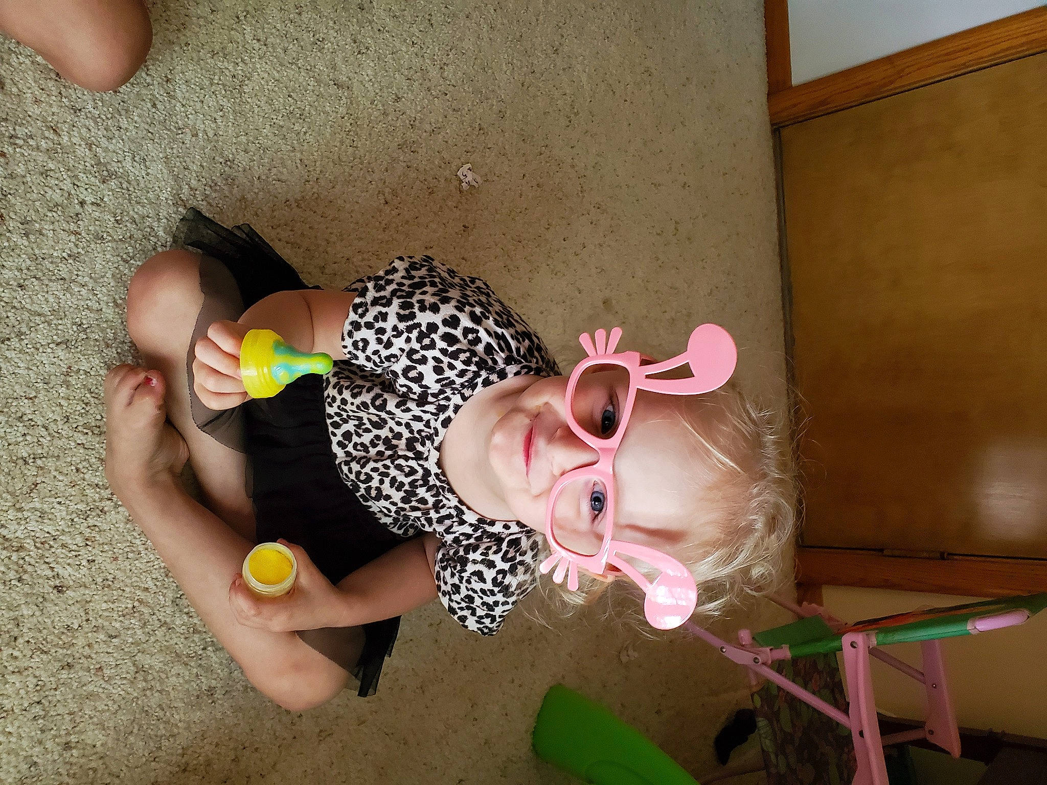 Aviana joined the competition — help win amazing prizes! calf, child, eyewear, fashion_accessory, fawn, foot, fun, happy, human_leg, knee, leg, nail, person, room, sandal, sunglasses, thigh, thumb, vision_care, wood