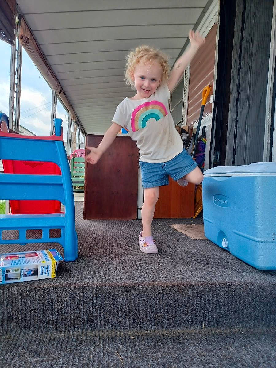 Aviana joined the competition — help win amazing prizes! automotive_exterior, blue, bumper, child, chute, city, electric_blue, flooring, fun, house, human_leg, joy, leisure, outdoor_play_equipment, person, play, recreation, shorts, standing, t_shirt