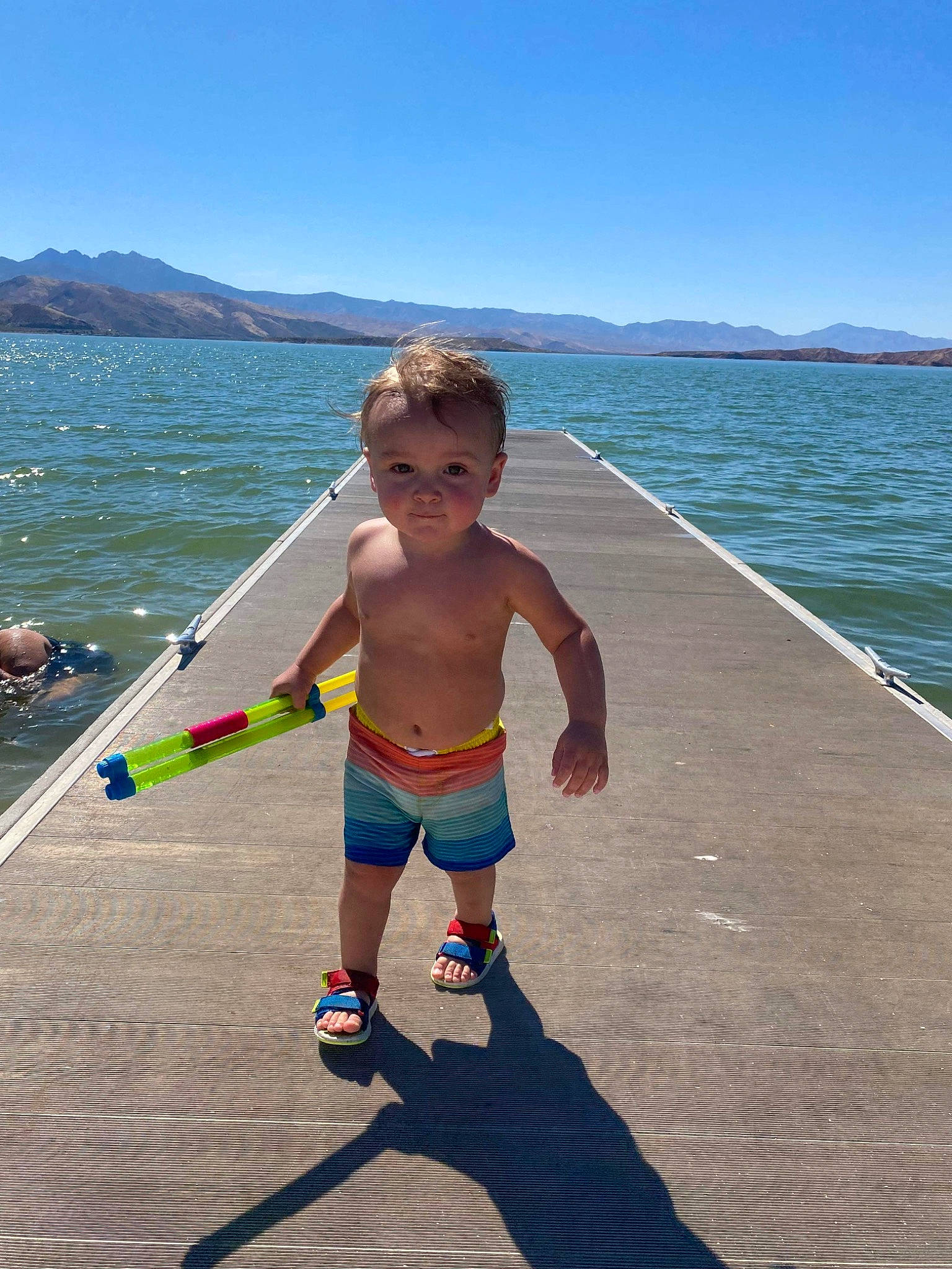 Zachary joined the competition — help win amazing prizes! azure, barechested, beach, boats_and_boating_equipment_and_supplies, elbow, fun, human_leg, knee, lake, leisure, people_on_beach, person, recreation, sand, shorts, sky, thigh, toddler, travel, trunks