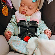 Braelynn joined the competition — help win amazing prizes! baby, infant, sleeping, car_seat, headband, bow, onesie, safety_harness, pink, mint_green, patterned_clothing, child, soft_toys, colorful_toy, indoor, close_up, peaceful, cute, seat, baby_care