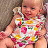 Braelynn joined the competition — help win amazing prizes! baby, child, couch, floral_clothing, smiling, sitting, hand, foot, texture, indoor, cute, happy, infant, romper, sibling, leg, person, head, colorful, portrait