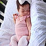 baby, sleeping, pink_outfit, white_bow, blanket, soft_texture, infant, cute, peaceful, closeup, child, indoors, cuteness, resting, newborn, portrait, clothing, sock, bunny, headwear