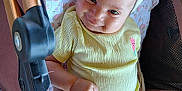 Alice joined the competition — help win amazing prizes! baby, child, smiling, yellow_outfit, headband, stroller, blanket, infant, cute, happy, face, person, clothing, fabric, skin, arm, leg, indoors, portrait, resting