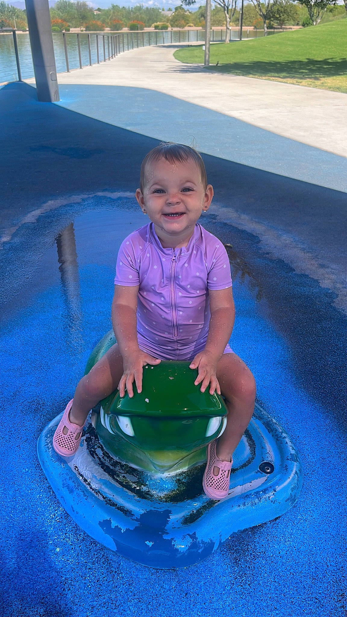 Mila joined the competition — help win amazing prizes! automotive_tire, automotive_wheel_system, baby_toddler_clothing, bumper, child, electric_blue, fun, grass, happy, joy, leisure, person, pink, play, purple, recreation, sitting, smile, summer, toddler