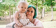 Khaleesi joined the competition — help win amazing prizes! woman, child, toddler, outdoor, trees, greenery, park, holding, smiling, portrait, casual, floral_dress, tattoos, family, nature, happy, daylight, cute, affection, love