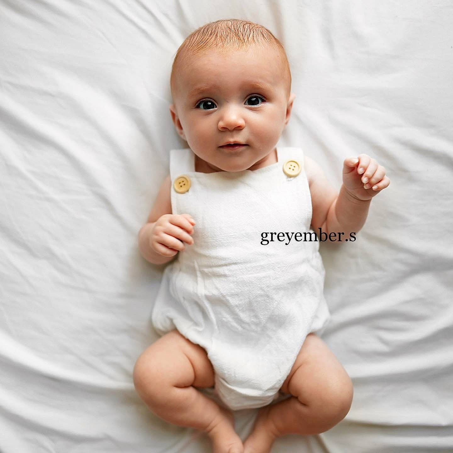Grey is registered to the contest to win money with this photo: arm, baby, baby_toddler_clothing, cheek, dress, eye, face, finger, gesture, hand, happy, head, lip, neck, nose, person, skin, sleeve, stomach, textile