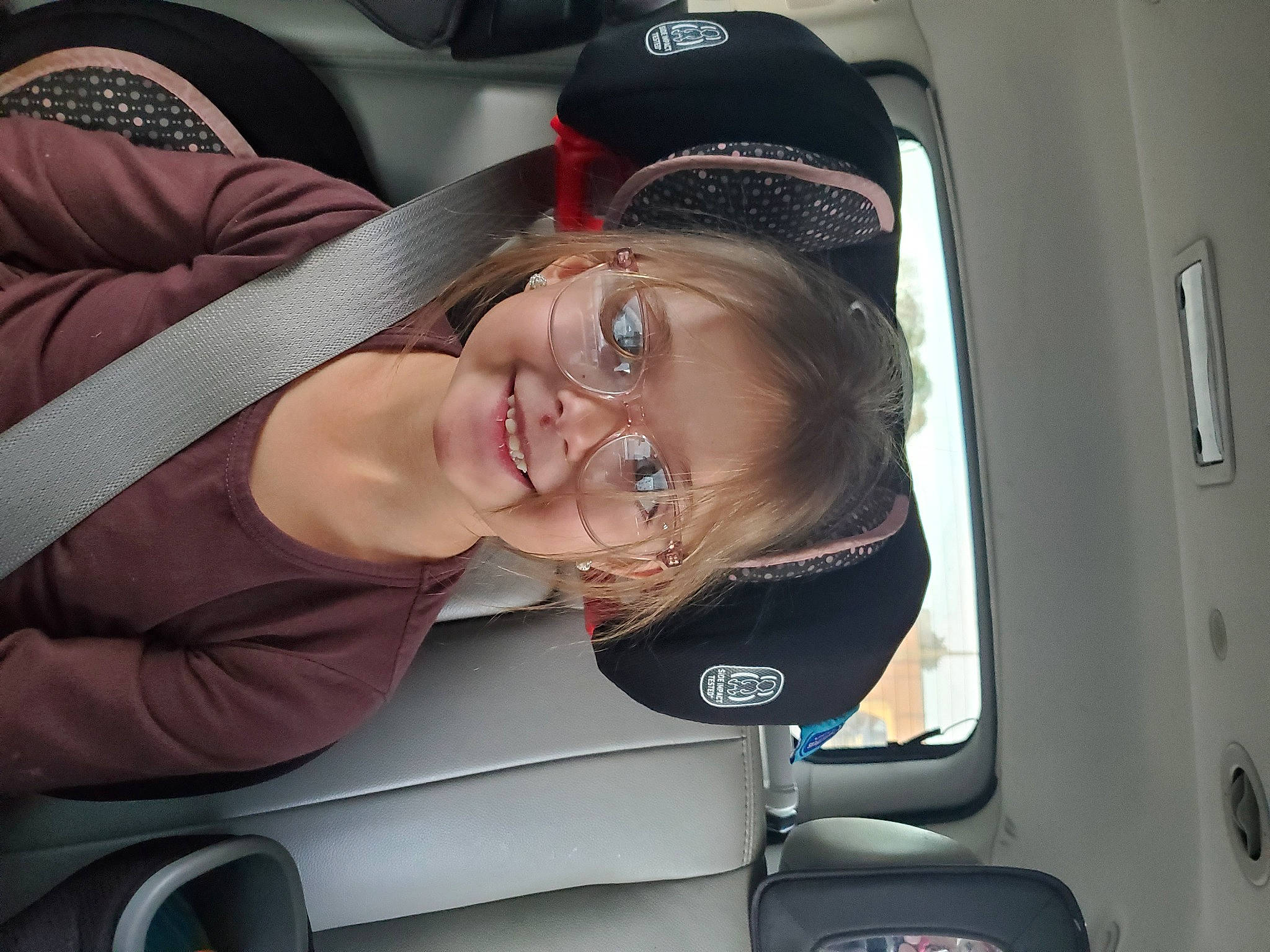 Aspen is registered to the contest to win money with this photo: auto_part, car, car_seat, family_car, head_restraint, joy, person, plant, seat_belt, vacation, vehicle, vehicle_door