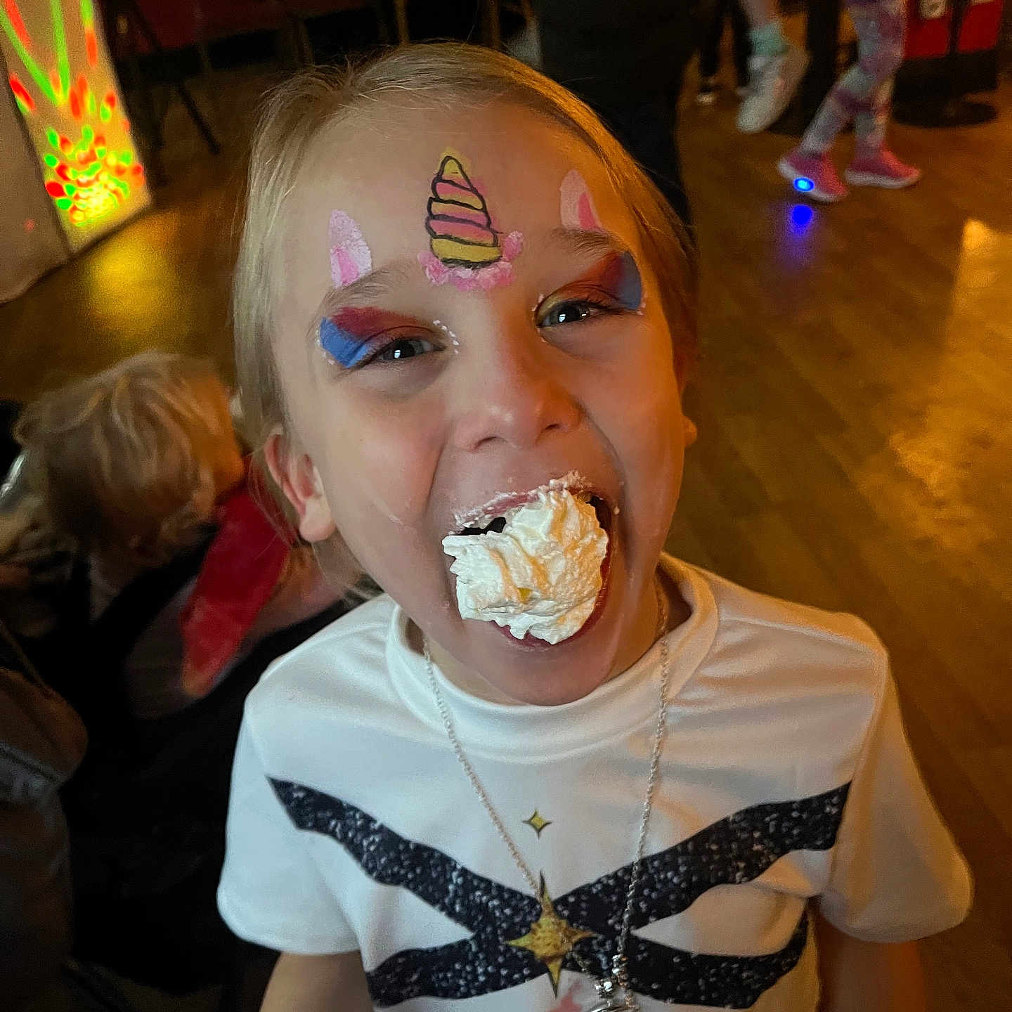 Melody-Kay joined the competition — help win amazing prizes! background, celebration, child, colorful, event, face_paint, floor, food, fun, happy, indoor, joy, messy, necklace, party, people, smiling, tshirt, unicorn, whipped_cream