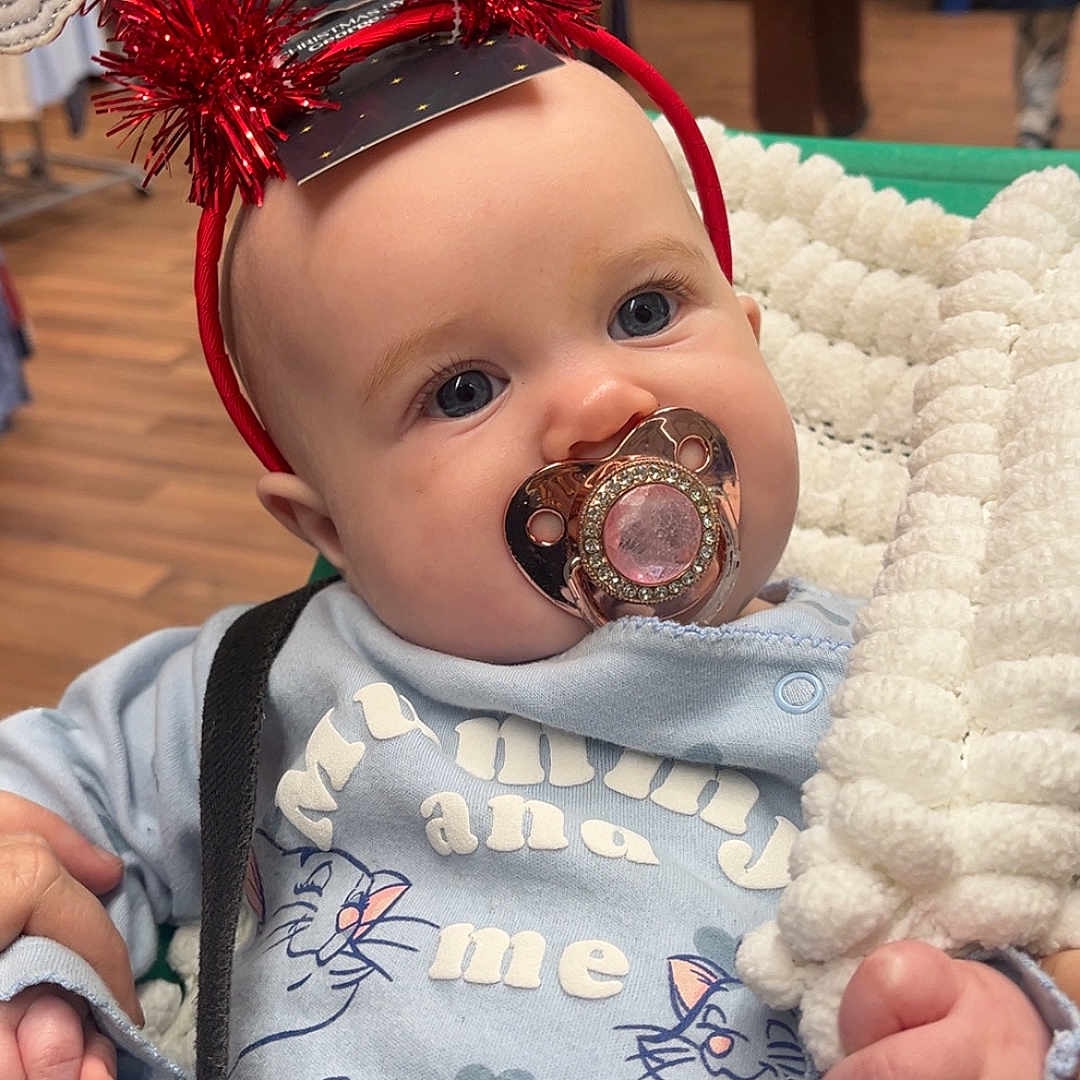 Ruby-Ray joined the competition — help win amazing prizes! baby, blanket, blue_eyes, child, clothing, cute, hand, headband, holiday, indoor, infant, pacifier, people, portrait, santa, shopping, smile, store, warm, winter_clothing