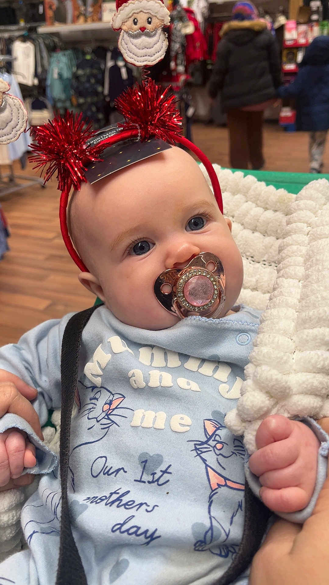 Ruby-Ray joined the competition — help win amazing prizes! baby, pacifier, headband, santa, blanket, blue_eyes, clothing, indoor, shopping, store, people, winter_clothing, cute, infant, hand, portrait, holiday, child, smile, warm