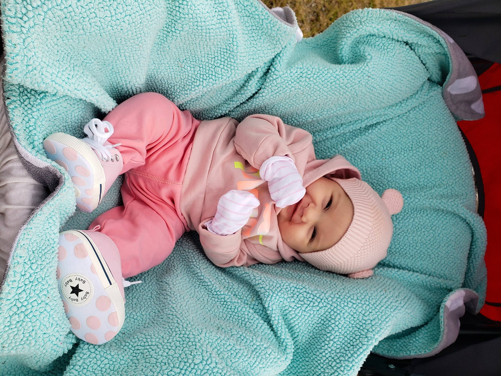 Marlee joined the competition — help win amazing prizes! baby, baby_products, baby_sleeping, baby_toddler_clothing, bedtime, child, comfort, face, fashion_accessory, grass, head, headwear, human_body, infant_bed, linens, person, pink, product, skin, textile