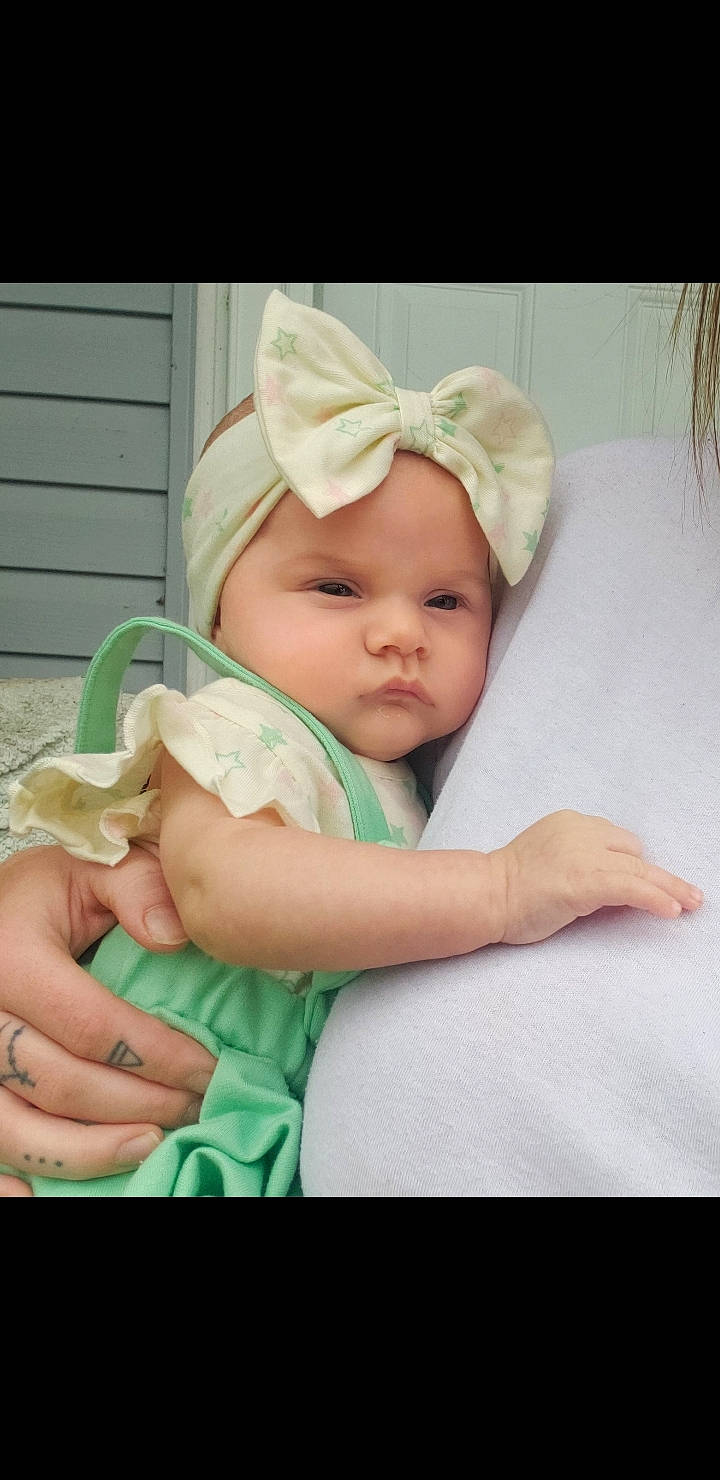 Marlee joined the competition — help win amazing prizes! baby, baby_products, baby_safety, baby_toddler_clothing, beanie, cap, cheek, child, comfort, fashion_accessory, grass, happy, hat, headband, headwear, linens, person, sitting, skin, sleeve