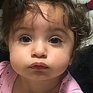 Summer joined the competition — help win amazing prizes! baby, child, close_up, cute, dark_hair, eyes, face, indoor, infant, looking_at_camera, messy_hair, pajamas, photography, pink_clothing, portrait, safe, seated, serious_expression, toddler, wide_eyed