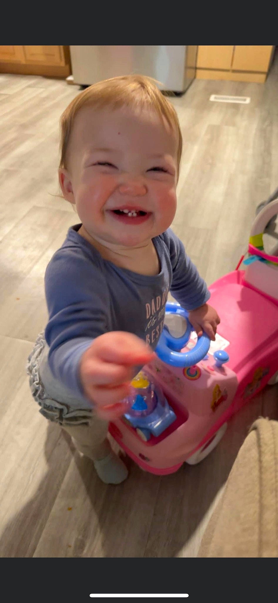 Bryleigh is registered to the contest to win money with this photo: baby, baby_playing_with_toys, baby_toddler_clothing, cheek, child, face, finger, fun, happy, head, human_body, joy, nose, person, play, sitting, skin, sleeve, smile, standing