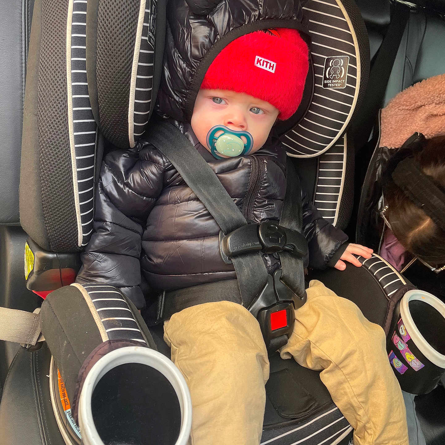 Layton Milian is registered to the contest to win money with this photo: baby, cap, clothing, coat, cushion, face, footwear, glove, hat, head, homedecor, jacket, pants, person, photography, portrait, shoe, sneaker, tape, transportation