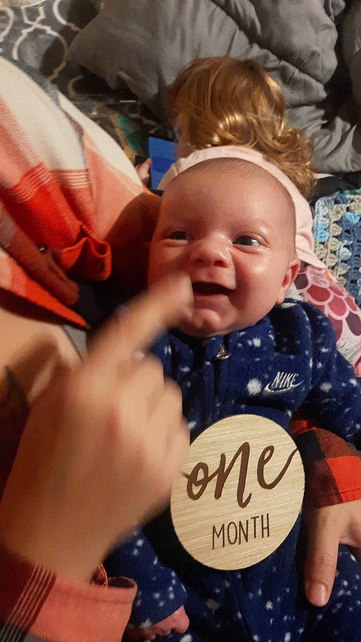Ryder is registered to the contest to win money with this photo: baby, baby_products, baby_toddler_clothing, cheek, child, comfort, event, finger, fun, gesture, happy, iris, nail, person, photo_caption, sitting, skin, smile, thumb, toddler