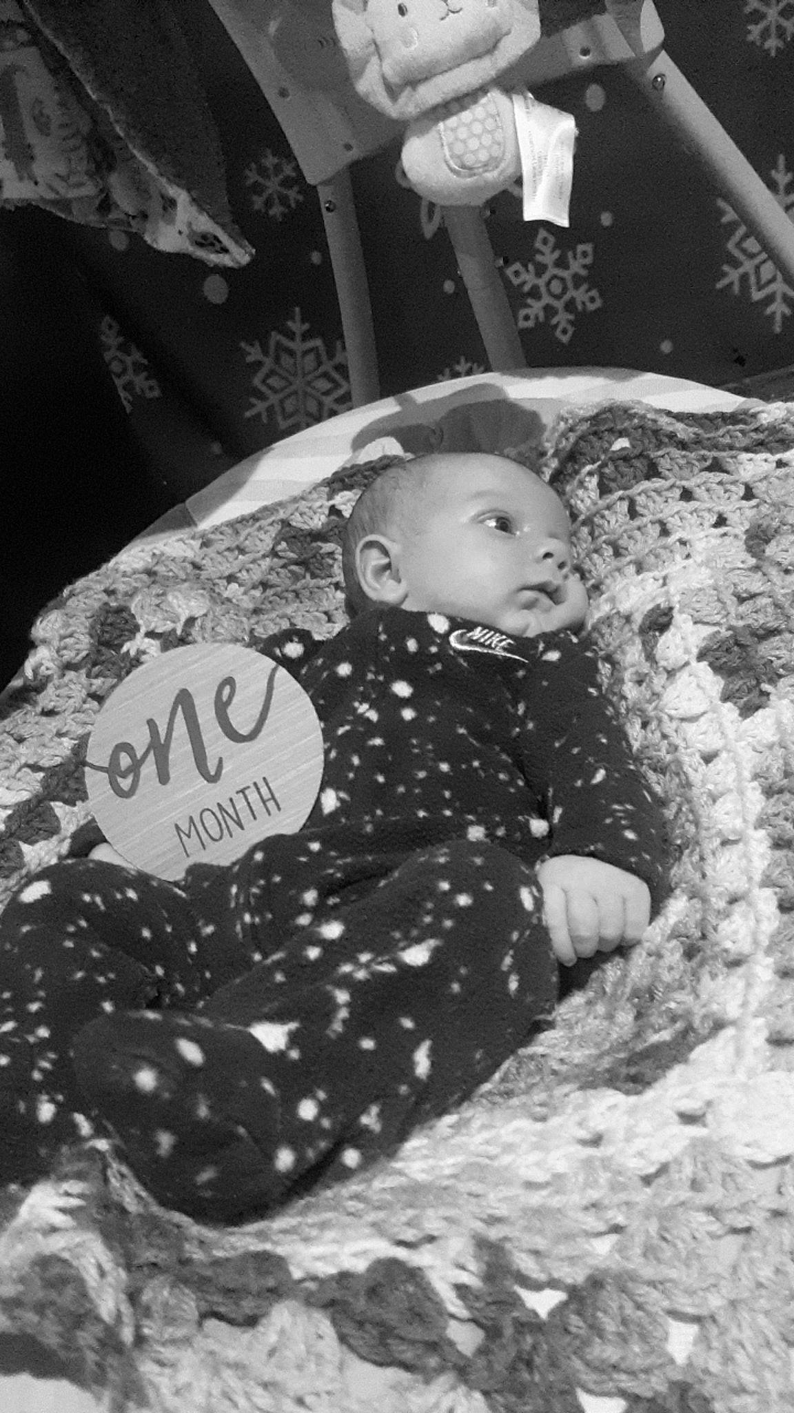 Ryder is registered to the contest to win money with this photo: baby, baby_products, baby_toddler_clothing, black, black_and_white, child, comfort, fun, grass, handwriting, happy, head, monochrome, monochrome_photography, pattern, person, play, sitting, style, toddler