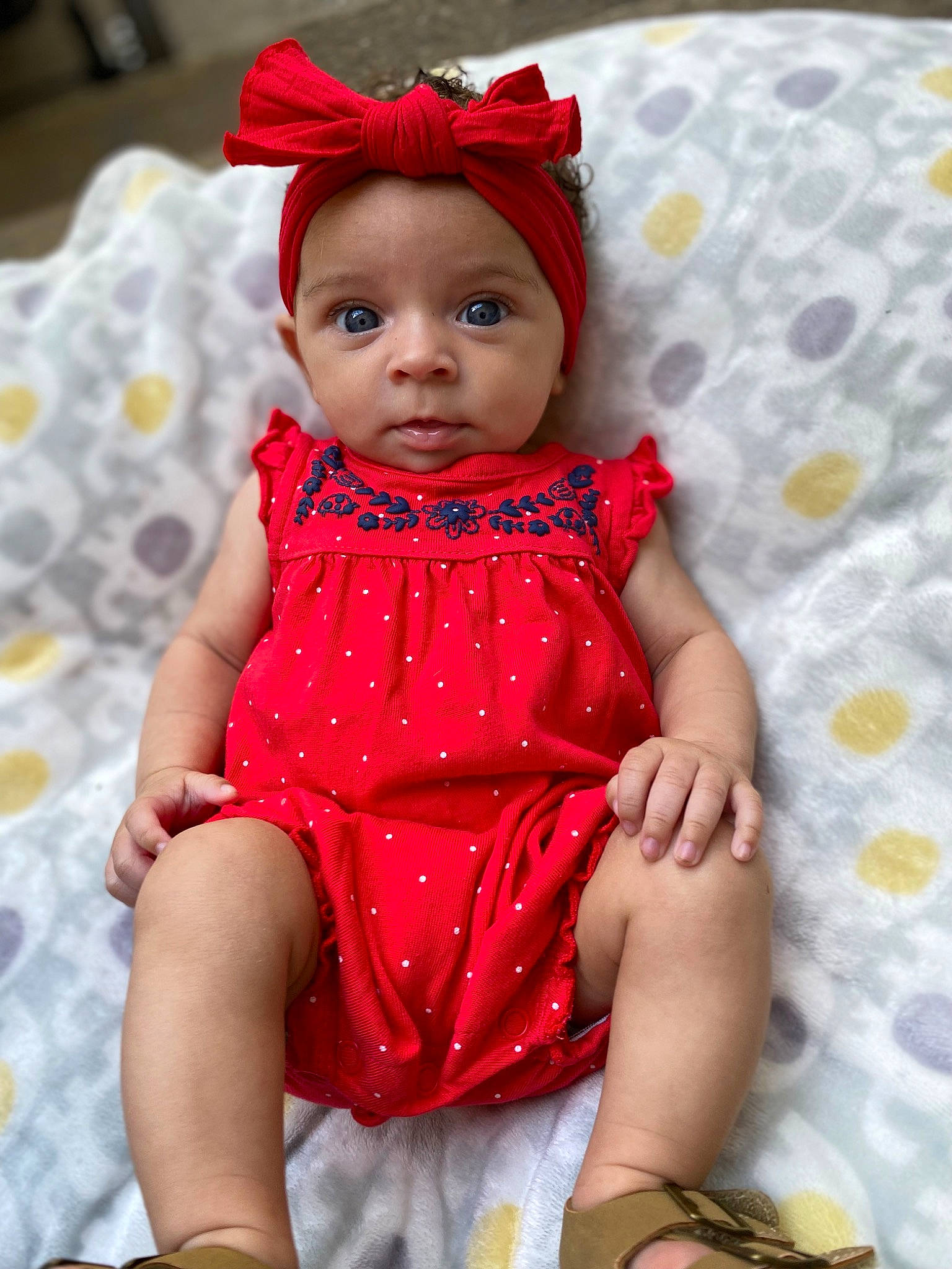 Mazikeen is registered to the contest to win money with this photo: baby, baby_toddler_clothing, cap, child, day_dress, dress, embellishment, face, fashion_accessory, happy, headwear, linens, magenta, pattern, peach, person, pink, purple, sitting, skin