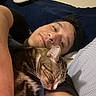 Danny is registered to the contest to win money with this photo: man, cat, bed, sleeping_cat, resting, indoor, cozy, tabby_cat, human, comfort, pillow, blanket, relaxed, closeup, pet, animal, portrait, snuggling, striped_cat, casual