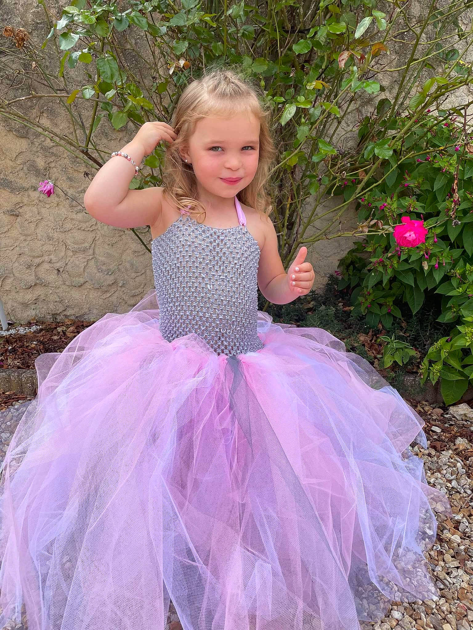 Eloane participe au concours pour gagner de l'argent avec cette photo : baby_toddler_clothing, ballet_tutu, bridal_clothing, bridal_party_dress, day_dress, dress, embellishment, face, gown, grass, happy, joy, magenta, people_in_nature, person, pink, plant, purple, ruffle, sleeve