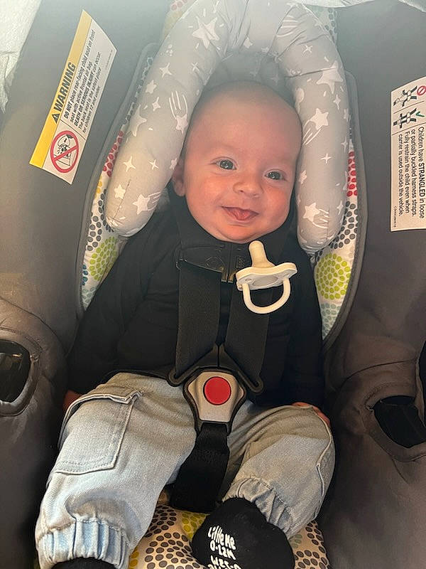 Reece James is registered to the contest to win money with this photo: aerospace_engineering, air_travel, airline, auto_part, baby, baby_carriage, baby_in_car_seat, baby_products, baby_safety, baby_toddler_clothing, car_seat, carmine, child, comfort, finger, fun, joy, person, sitting, skin