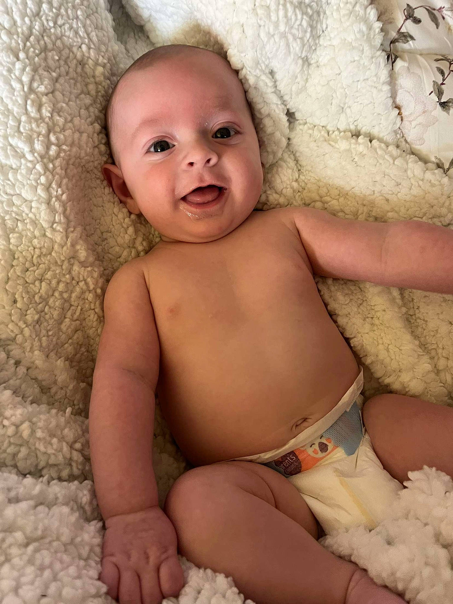 Reece James is registered to the contest to win money with this photo: arm, baby, cheek, eye, eyebrow, face, finger, head, human_body, iris, lip, mouth, neck, nose, organ, person, photograph, skin, smile, stomach