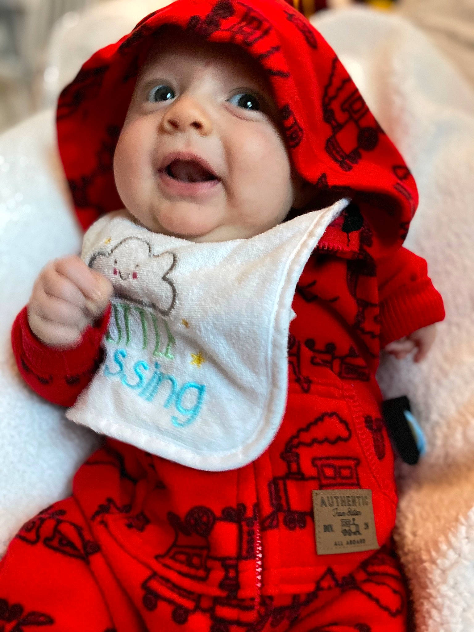 Callan joined the competition — help win amazing prizes! baby, baby_toddler_clothing, cap, cheek, comfort, face, happy, headgear, headwear, lip, mouth, organ, outerwear, person, pink, red, skin, sleeve, smile, textile