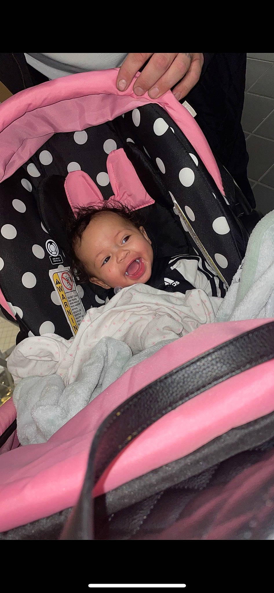 Marjhae Butler is registered to the contest to win money with this photo: auto_part, baby, baby_carriage, baby_products, baby_toddler_clothing, black, car_seat, child, comfort, fun, grass, magenta, pattern, person, pink, product, sitting, sleeve, smile, toddler