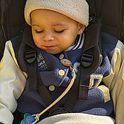 Noah Daniel a rejoint le concours — aidez-le/la à gagner de superbes lots ! baby, beanie, blanket, bundle, child, closed_eyes, comfort, cute, infant, jacket, outside, pacifier, peaceful, portrait, seatbelt, stroller, sunlight, toddler, warm_clothing, young_child