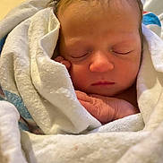 Navy is registered to the contest to win money with this photo: newborn, baby, sleeping, blanket, wrapped, soft, infant, face, hand, peaceful, cute, closeup, skin, resting, indoors, portrait, child, young, cozy, warm