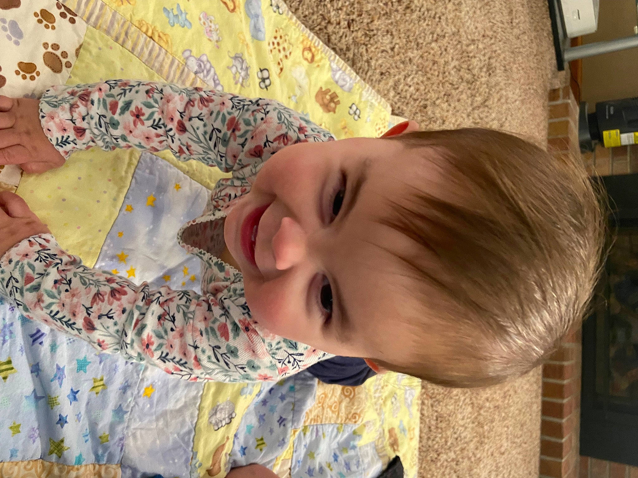 Charlotte is registered to the contest to win money with this photo: baby, baby_laughing, baby_toddler_clothing, cheek, child, flooring, fun, happy, joy, linens, mammal, nose, pattern, people, person, room, skin, smile, toddler, visual_arts