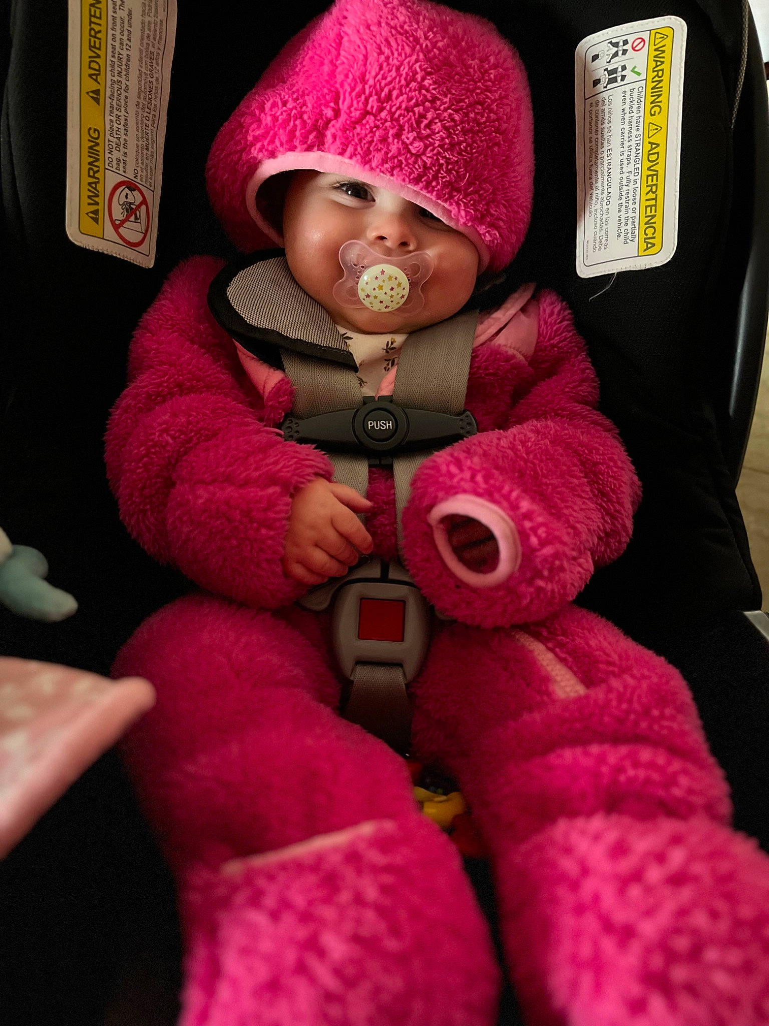Charlotte joined the competition — help win amazing prizes! baby, baby_carriage, baby_toddler_clothing, cap, car_seat, cheek, child, comfort, eye, head, headgear, headwear, jacket, knit_cap, magenta, person, pink, red, seat_belt, sleeve