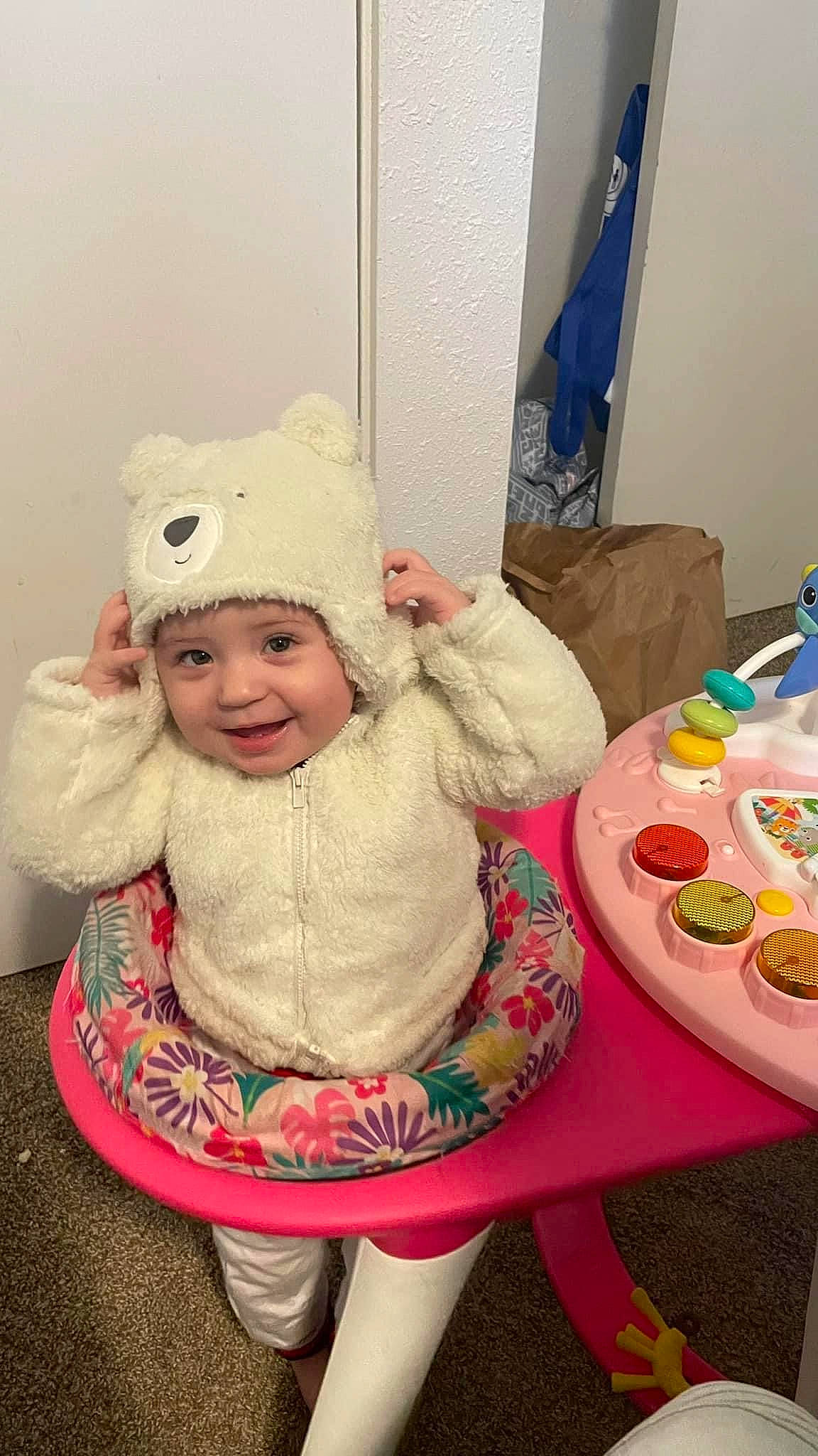 Jacquelyn joined the competition — help win amazing prizes! baby, baby_toddler_clothing, cap, child, christmas_eve, costume_hat, event, fashion_accessory, fun, happy, headwear, holiday, joy, person, pink, plate, room, sitting, sleeve, smile