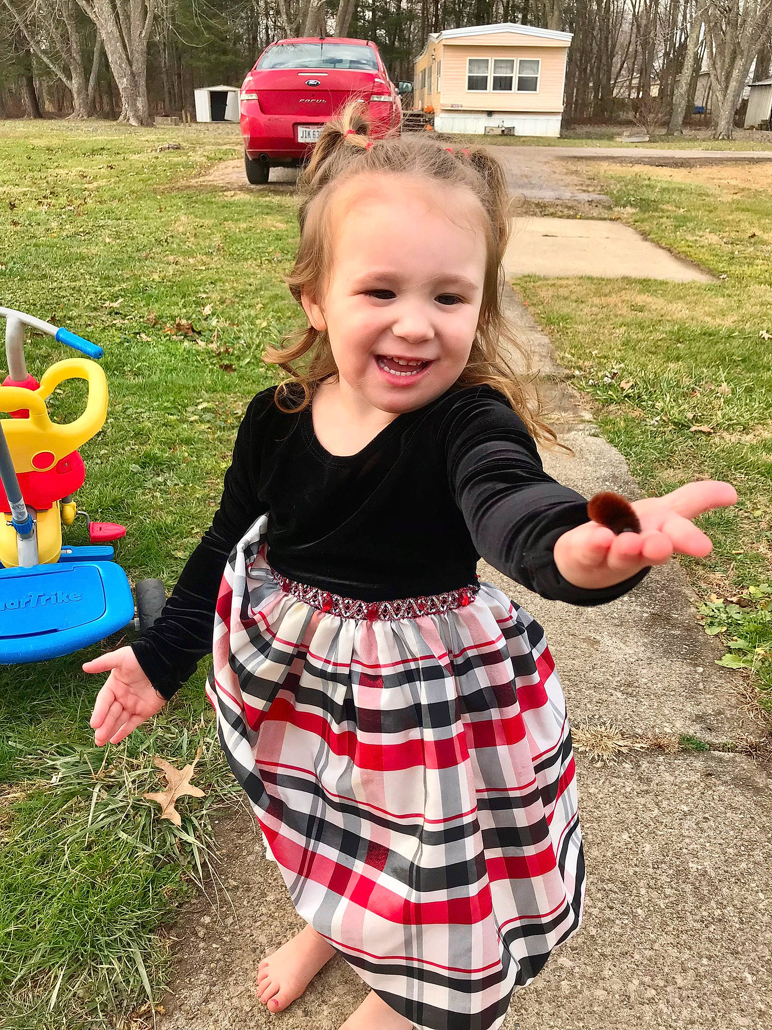 Moon is registered to the contest to win money with this photo: car, child, dress, fun, grass, green, happy, joy, pattern, people_in_nature, person, pink, plaid, plant, recreation, smile, summer, tartan, tire, toddler
